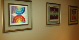 Three artworks by Agam, framed with dual metal frames and double glass.